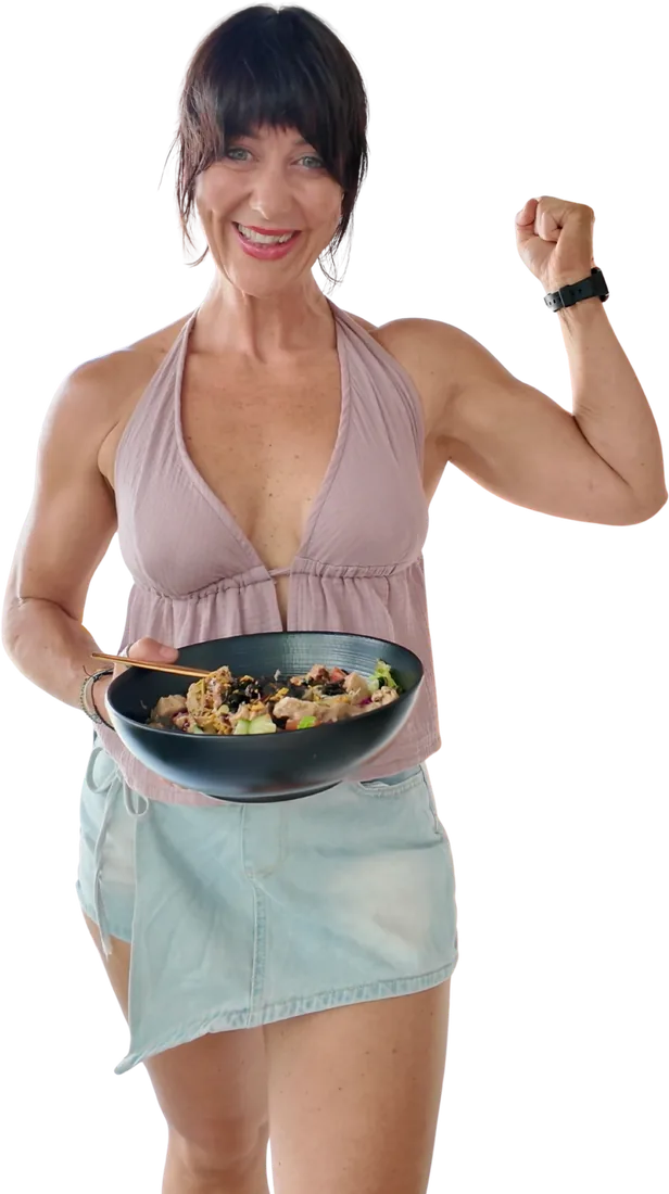 Vicki Jones holding a plant-based bowl and flexing her bicep